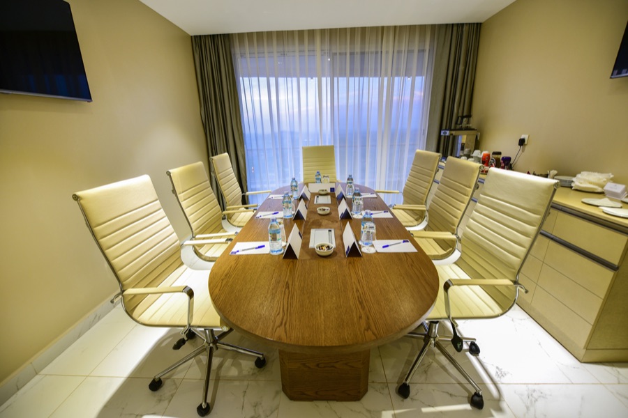 Executive boardroom with modern table and leather seating
