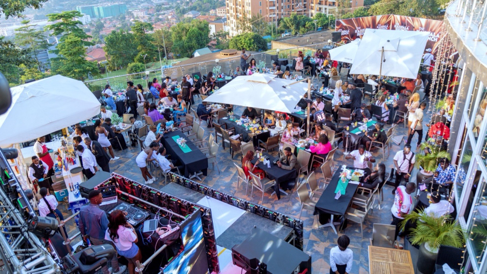 Lariza Terrace open-air rooftop with guests overlooking Kampala