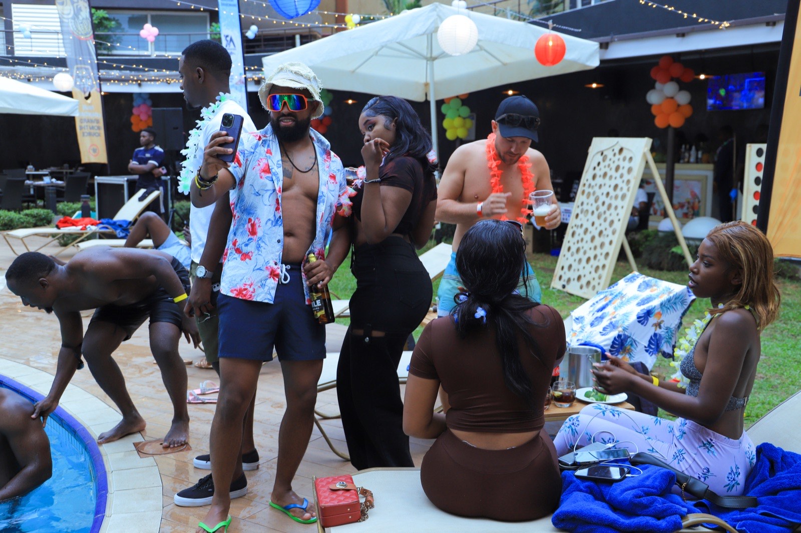 Guests enjoying a poolside party at Tropicanna Poolside